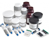 Radio opaque inks and adhesives are used to print visible tags for X-Ray, CT, CAT